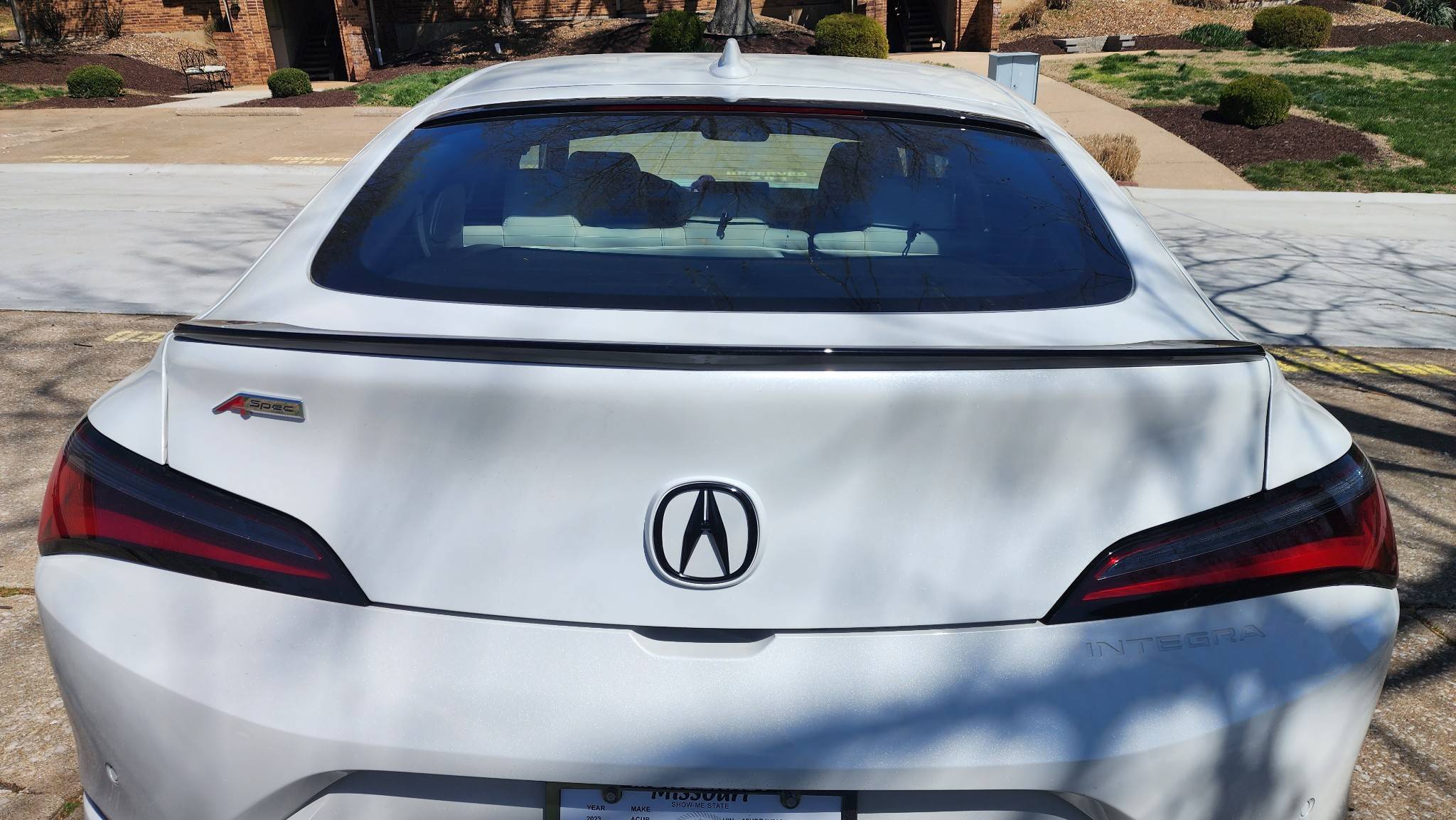 Acura Integra Rear black emblem install with white background. messages_0 (1)