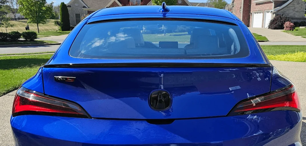 Acura Integra Chrome VS Blacked out Emblems (side by side) 1701184434362