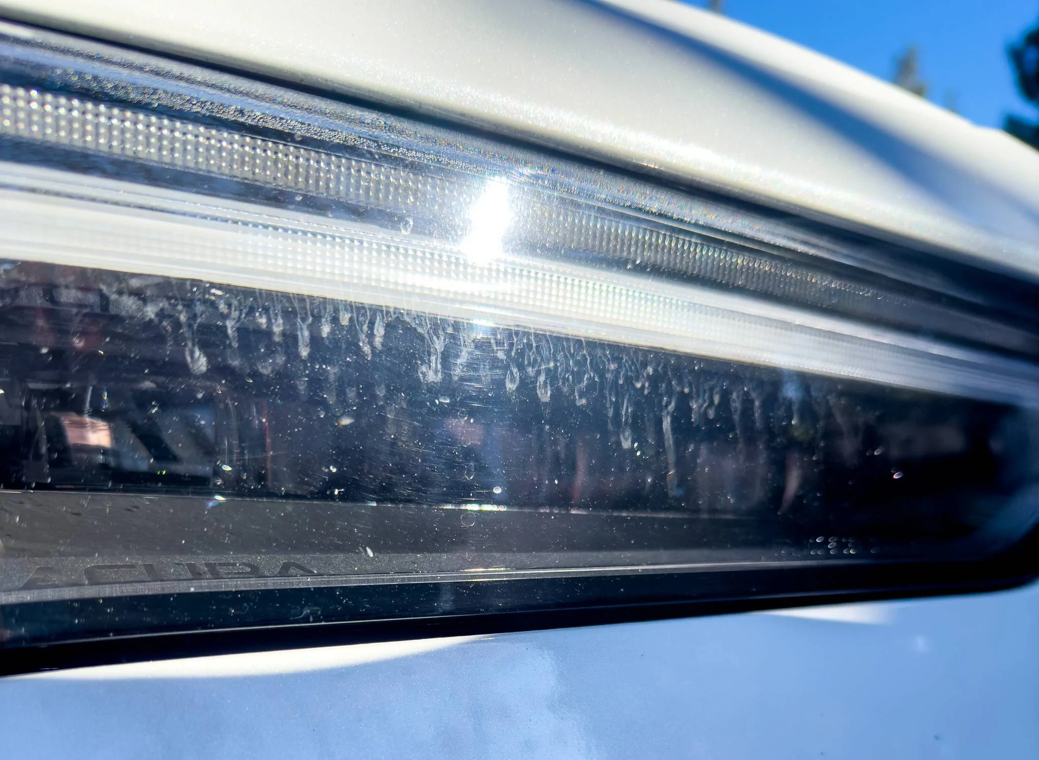 Acura Integra Residue on inside of both headlights Joe_Baker_Integra_Headlight_defect