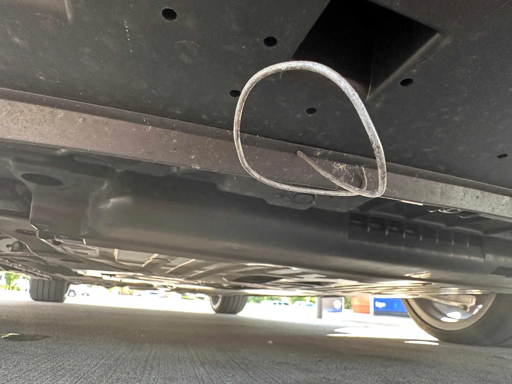 Acura Integra Metal wire hanging beneath front of car IMG_2963